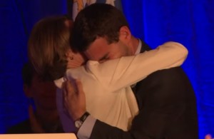 Mike Firestone and Healey embrace on primary night after Healey called him to the stage. (via Youtube/Healey campaign)